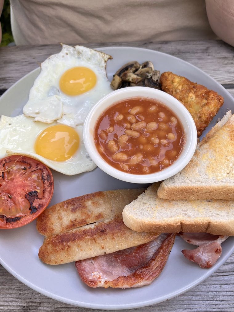 Fried egg breakfast plate with hash brown and toast